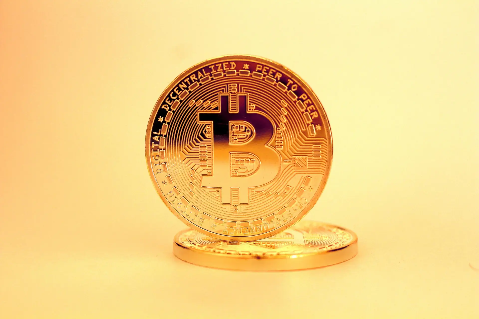 A close-up of a golden Bitcoin highlighting its digital currency design.